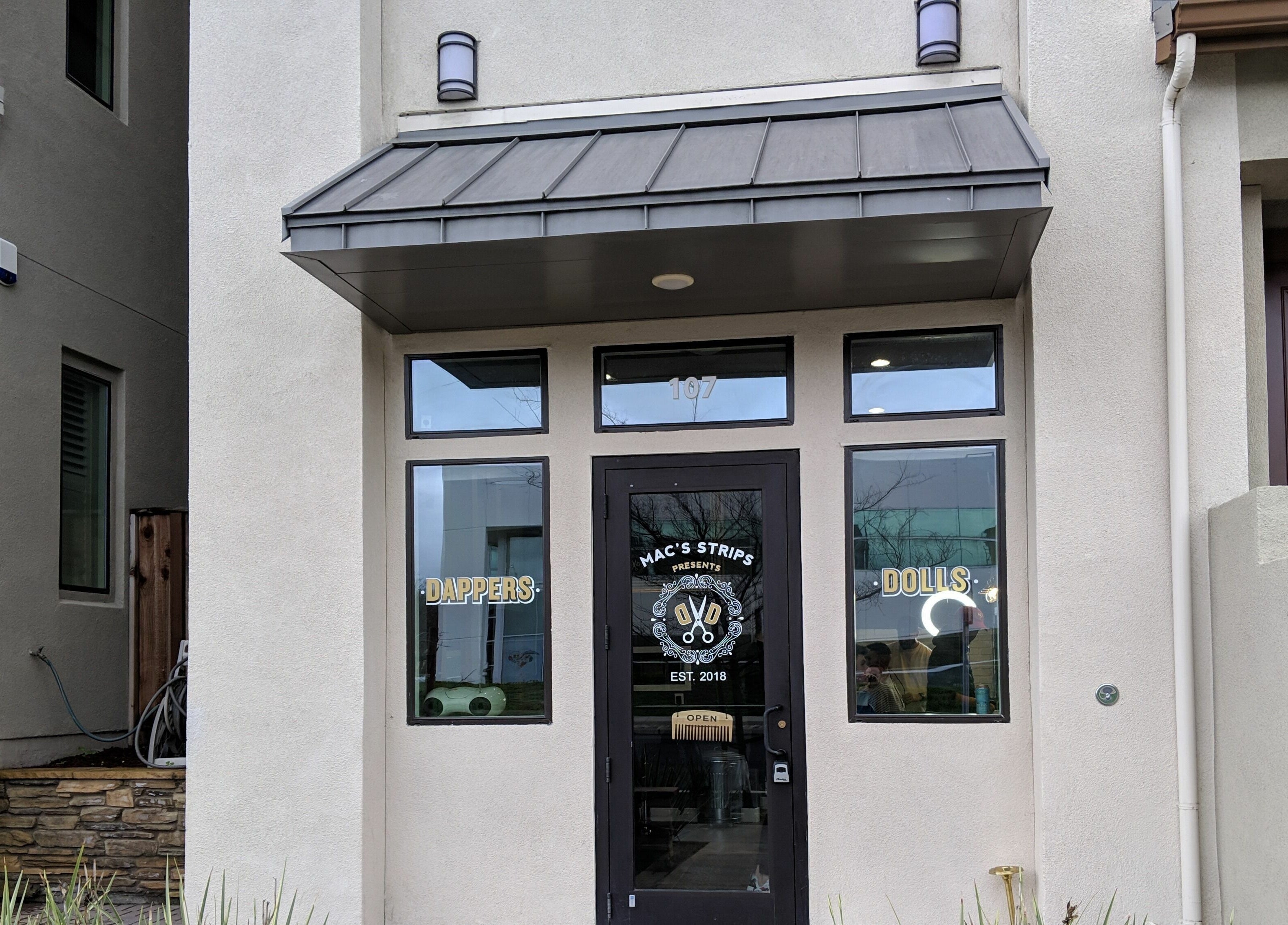 Entrance of Dappers and Dolls, Milpitas, California featuring stylish exterior.