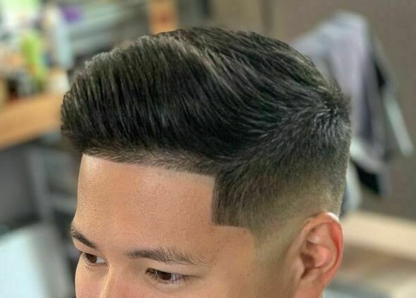 Close-up of a stylish men's haircut at Dappers and Dolls, Milpitas, California, US.