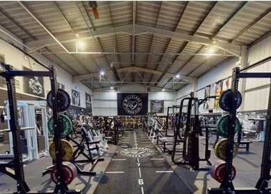 Modern gym at Lift With Leah in Birmingham, England, GB featuring weightlifting equipment and spacious workout area.