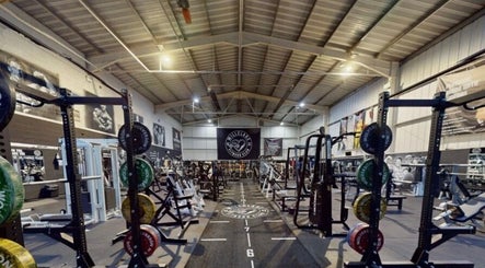 Modern gym at Lift With Leah in Birmingham, England, GB featuring weightlifting equipment and spacious workout area.