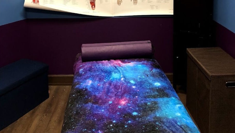 Relaxing therapy room at Truly Gifted Therapy, Washington, DC, US with galaxy-themed decor.