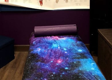 Relaxing therapy room at Truly Gifted Therapy, Washington, DC, US with galaxy-themed decor.