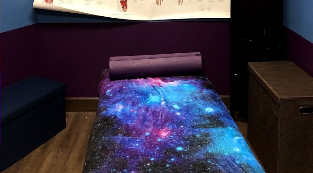 Relaxing therapy room at Truly Gifted Therapy, Washington, DC, US with galaxy-themed decor.