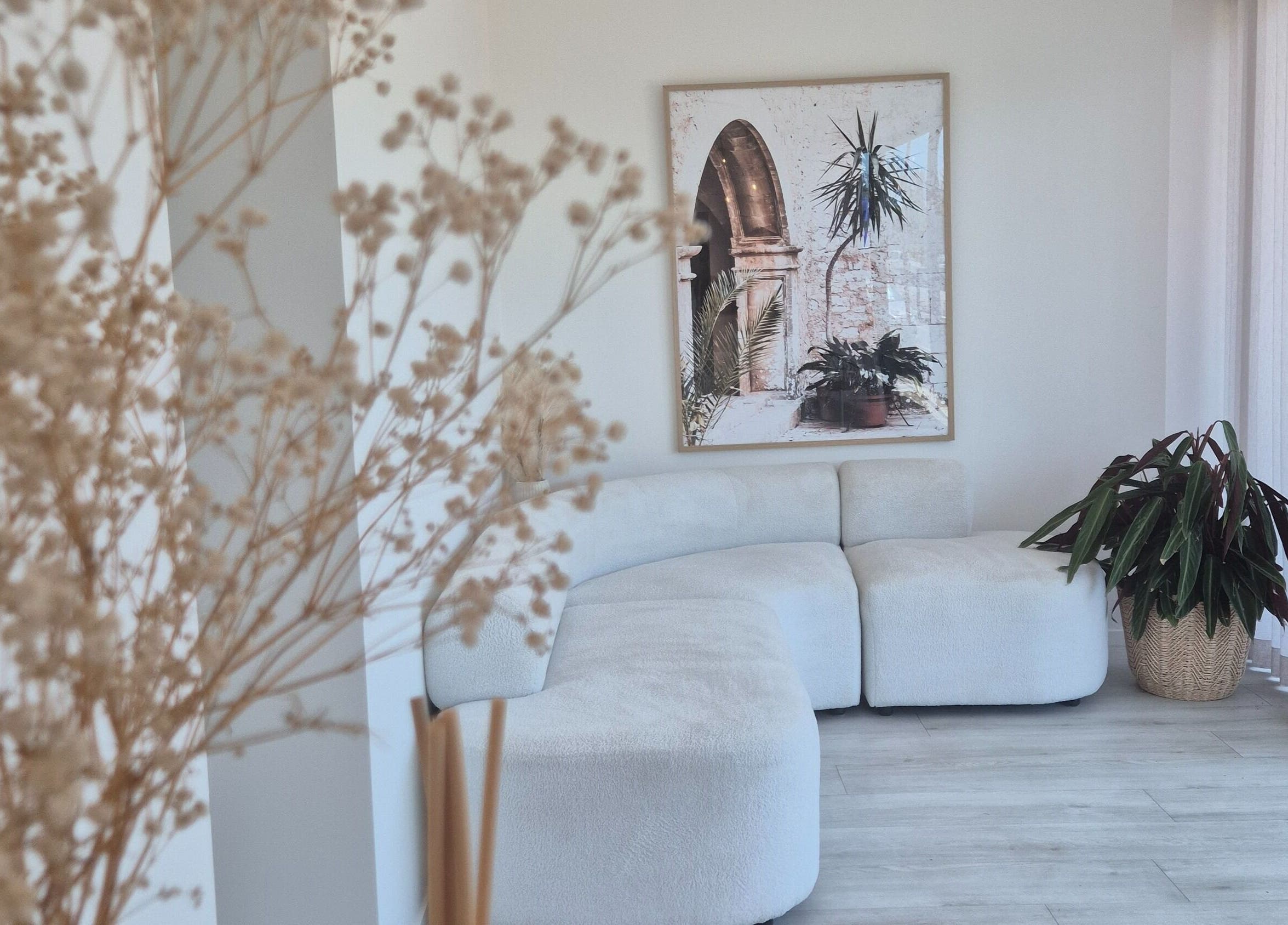 Relaxing lounge area at Iluka Skin, Maroochydore, Queensland, AU with modern decor and plant accents.