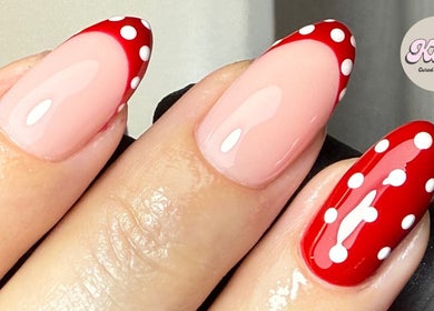 Stylish red and white polka dot nail art at CURED BY KHLO, Great Bookham, England, GB.
