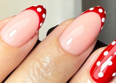 Polka dot nail design at CURED BY KHLO in Great Bookham, England, GB featuring red and white elegance.