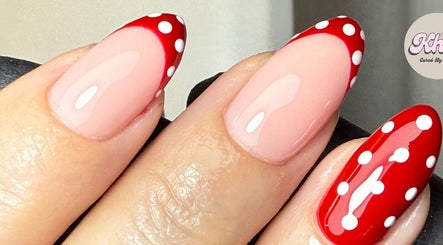 Polka dot nail design at CURED BY KHLO in Great Bookham, England, GB featuring red and white elegance.