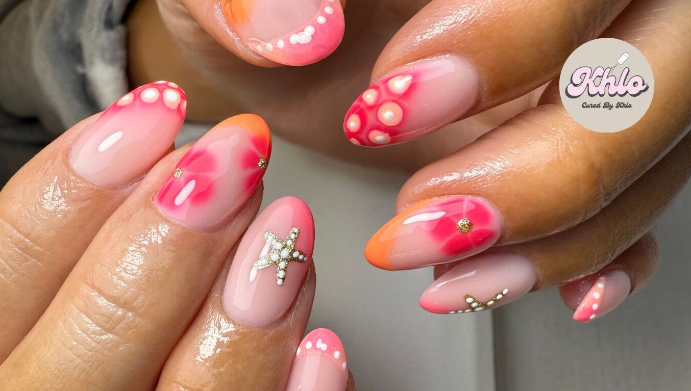 Close-up of vibrant nail art with star designs at CURED BY KHLO, Great Bookham, England, GB.