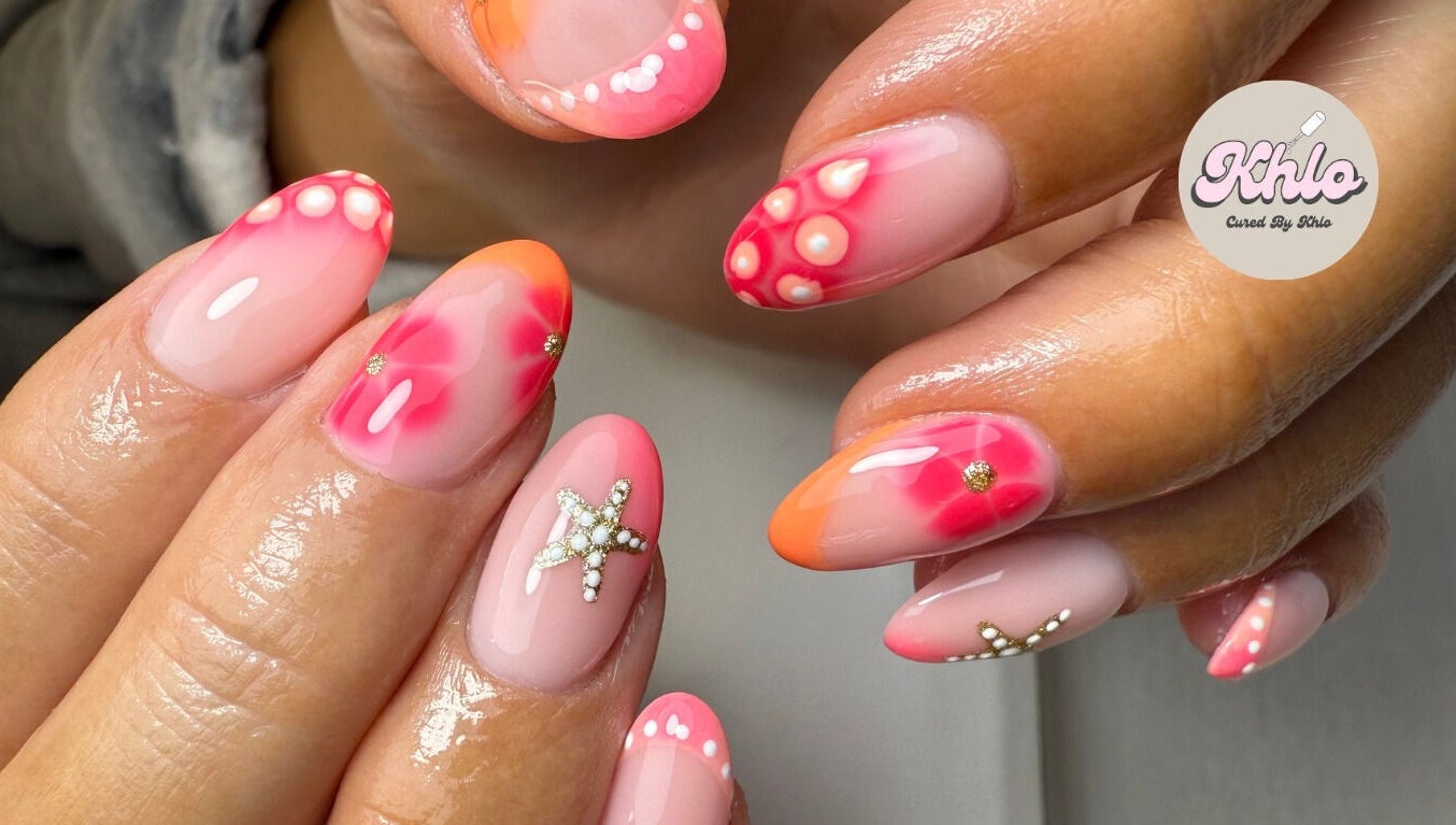 Close-up of vibrant nail art with star designs at CURED BY KHLO, Great Bookham, England, GB.