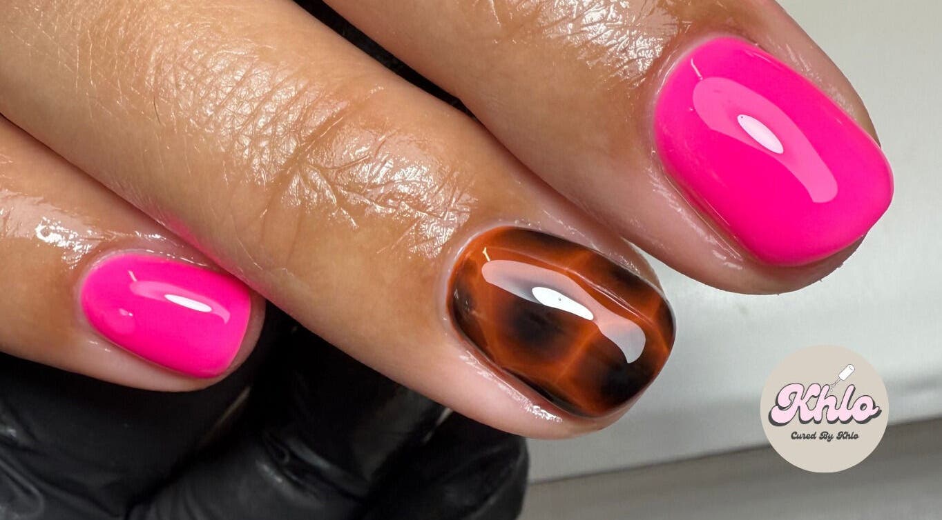 Bright pink and tortoiseshell nails at CURED BY KHLO, Great Bookham, England, GB.