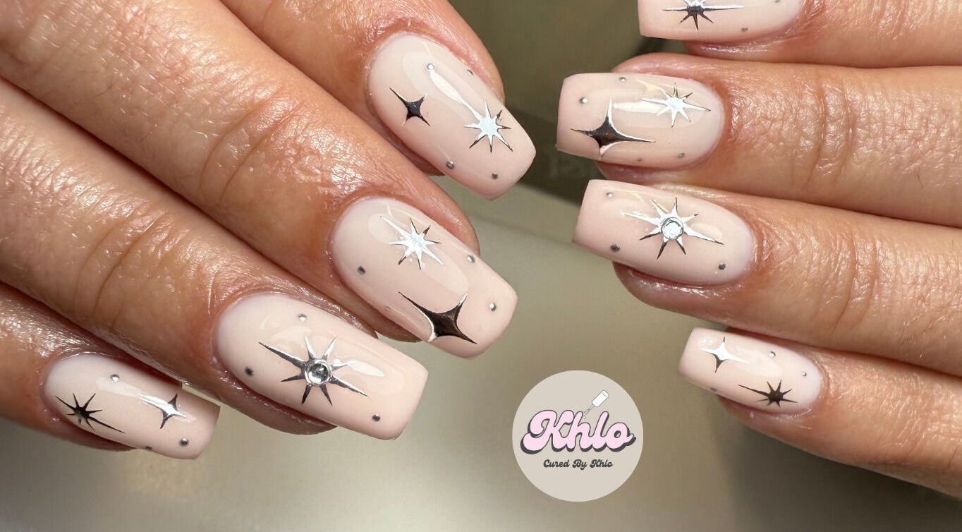 Elegant star nail art at CURED BY KHLO in Great Bookham, England, GB, showcasing intricate star designs.