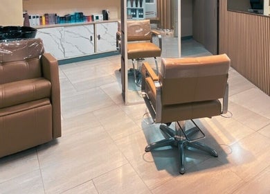 Modern interior of SVS Korean Beauty Salon - Makati, featuring sleek styling chairs and mirrors. Located in Makati, Metro Manila, PH.