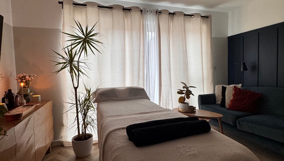 Serene therapy room at Gaia Holistics in Clifton Upon Dunsmore, England, GB with cozy decor and soft lighting.