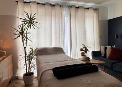 Serene therapy room at Gaia Holistics in Clifton Upon Dunsmore, England, GB with cozy decor and soft lighting.