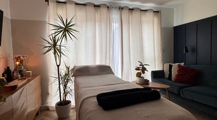 Serene therapy room at Gaia Holistics in Clifton Upon Dunsmore, England, GB with cozy decor and soft lighting.
