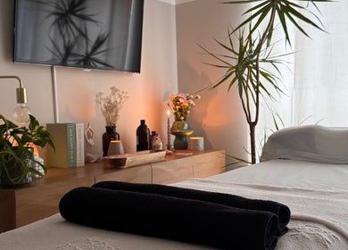 Relaxing therapy room at Gaia Holistics, Clifton Upon Dunsmore, England, GB. A tranquil space with plants and candles.