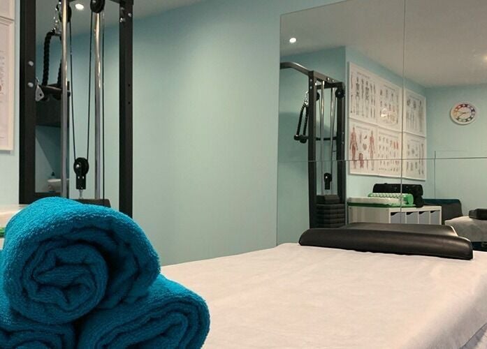 Relaxation room at SPINEWELL - Remedial and Sports Massage Therapy in Dunfermline, DUNFERMLINE, GB, featuring teal towels.