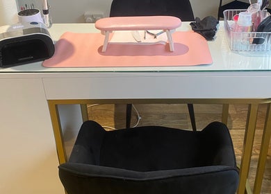 Nl Nails modern nail station setup in Telford, England, GB, with manicure tools and pink mat.