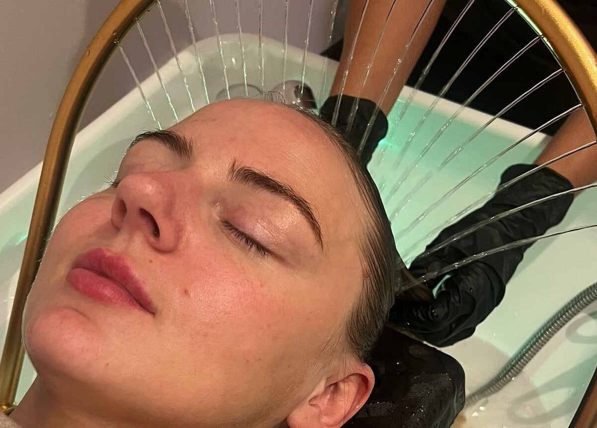 Relaxing hair treatment at Kmac Studio in Dunbar, Scotland, GB, featuring a soothing scalp massage.