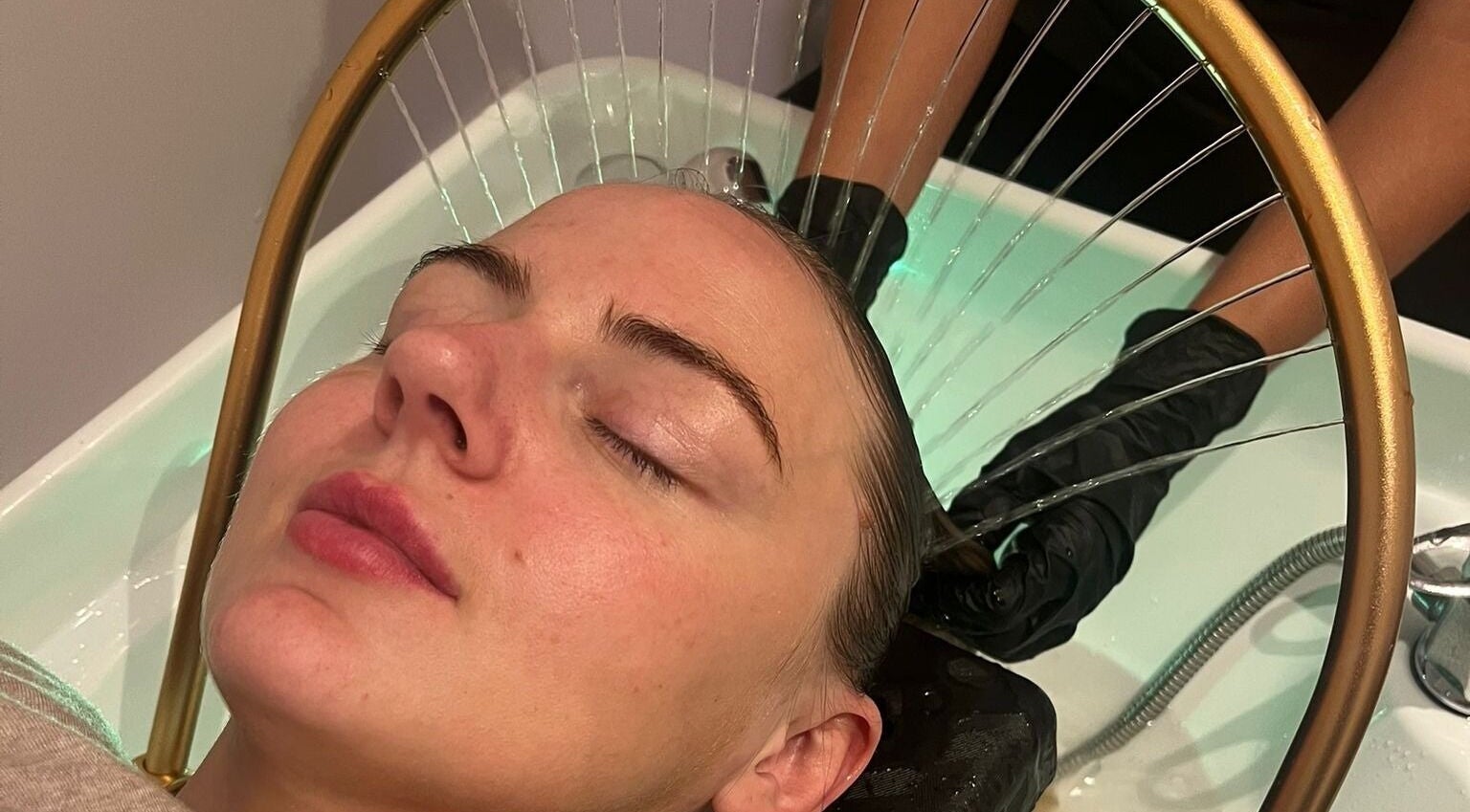 Relaxing hair treatment at Kmac Studio in Dunbar, Scotland, GB, featuring a soothing scalp massage.
