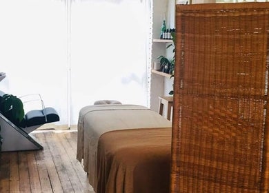 Relaxing therapy room featuring a massage table at Breathe Barbers, London, England, GB.