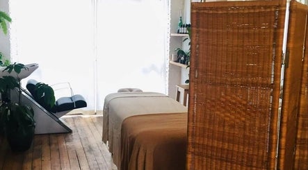 Relaxing therapy room featuring a massage table at Breathe Barbers, London, England, GB.