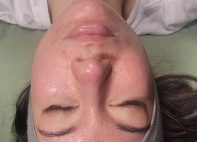 Relaxed face during a rejuvenating facial at Luxe Wellness Spa, Sugar Land, Texas, US.
