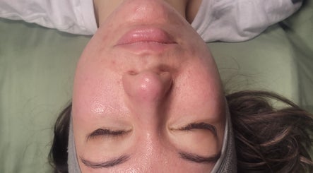 Relaxed face during a rejuvenating facial at Luxe Wellness Spa, Sugar Land, Texas, US.