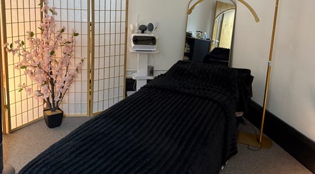Relaxing treatment room at Beaute Lounge MediSpa, Merthyr Tydfil, Wales, GB with a plush massage bed.