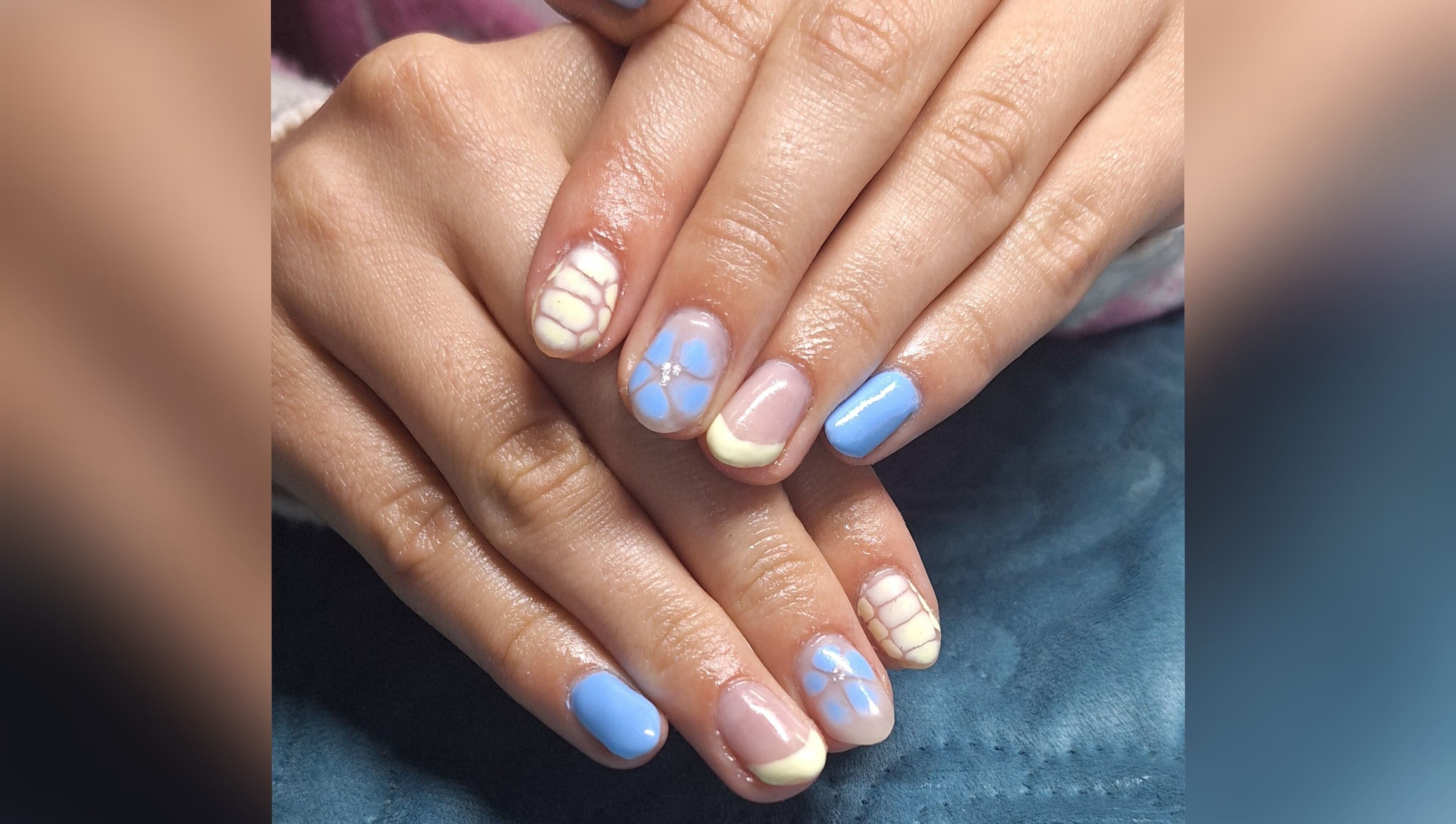Intricate blue and white nail art at Ms Nailbeauty Salon, Bloemfontein, Free State, ZA.