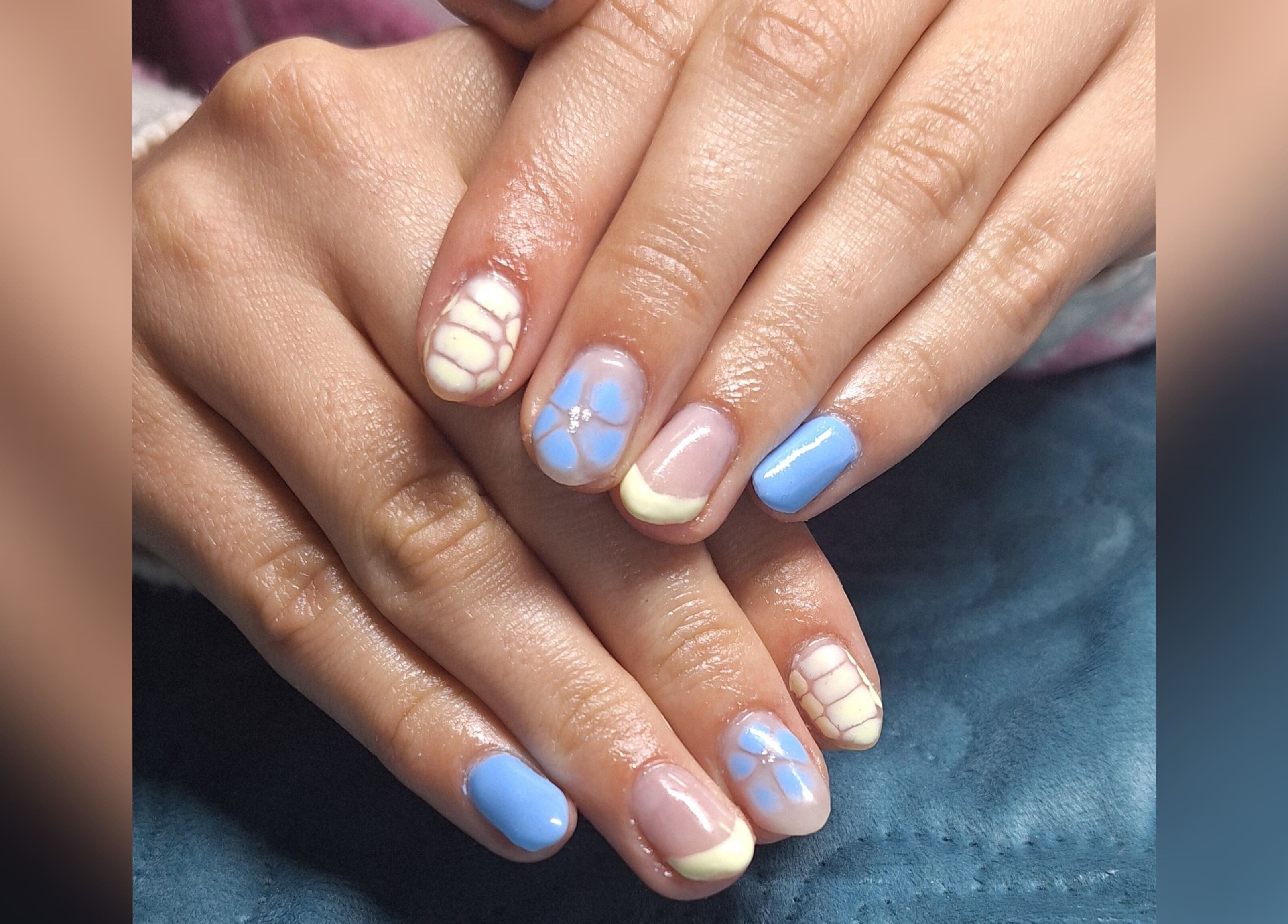 Intricate blue and white nail art at Ms Nailbeauty Salon, Bloemfontein, Free State, ZA.