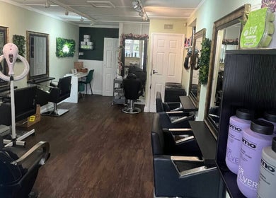 Hair by Faye salon interior in Colchester, England, GB, featuring stylish stations and modern decor.