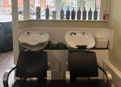Elegant wash stations at Hair by Faye in Colchester, England, GB, showcasing modern hair care facilities.