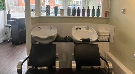 Elegant wash stations at Hair by Faye in Colchester, England, GB, showcasing modern hair care facilities.
