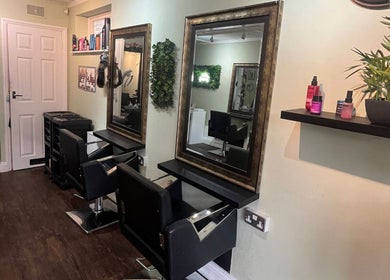Hair by Faye salon interior in Colchester, England, GB with modern chairs and mirrors.