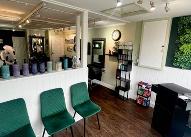 Interior of Hair by Faye in Colchester, England, GB, featuring elegant decor and hair products on display.