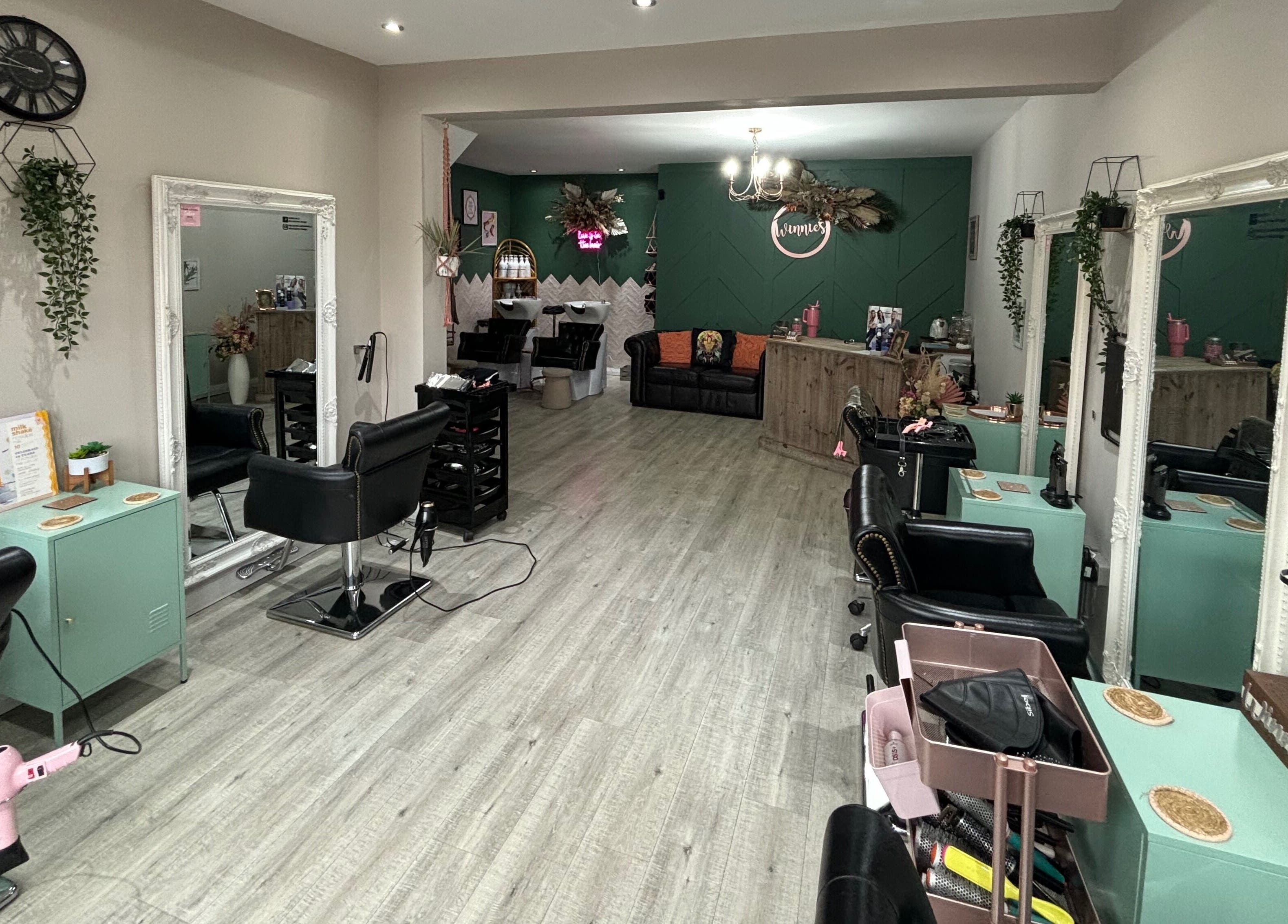 Chic interior of Winnie’s Hair Design in Newcastle upon Tyne, England, GB, showcasing styling stations and decor.