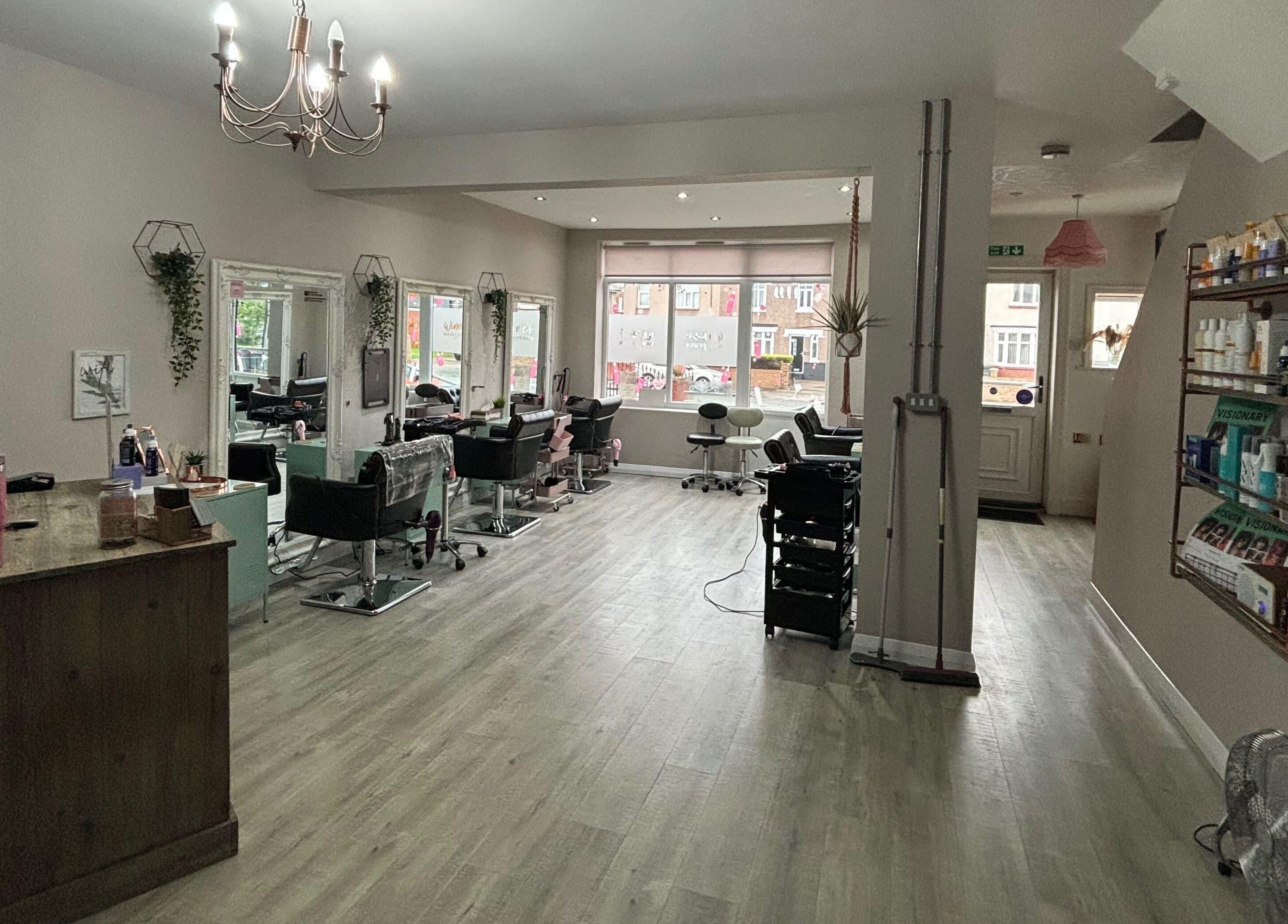 Chic interior of Winnie’s Hair Design, Newcastle upon Tyne, England, GB showcasing elegant styling stations.