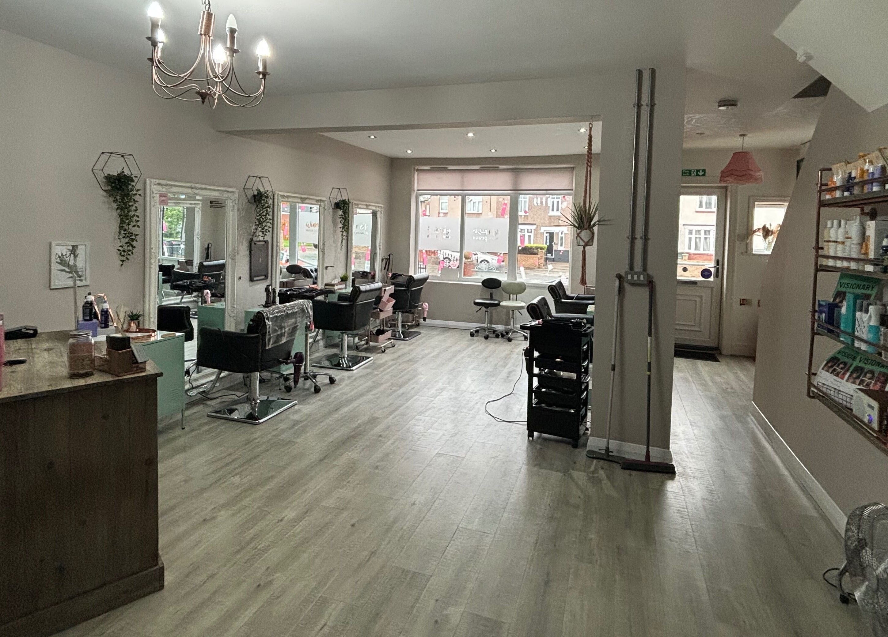 Chic interior of Winnie’s Hair Design, Newcastle upon Tyne, England, GB showcasing elegant styling stations.