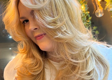 Blonde woman with styled curls at Hair By David, East Kilbride, Scotland, GB.