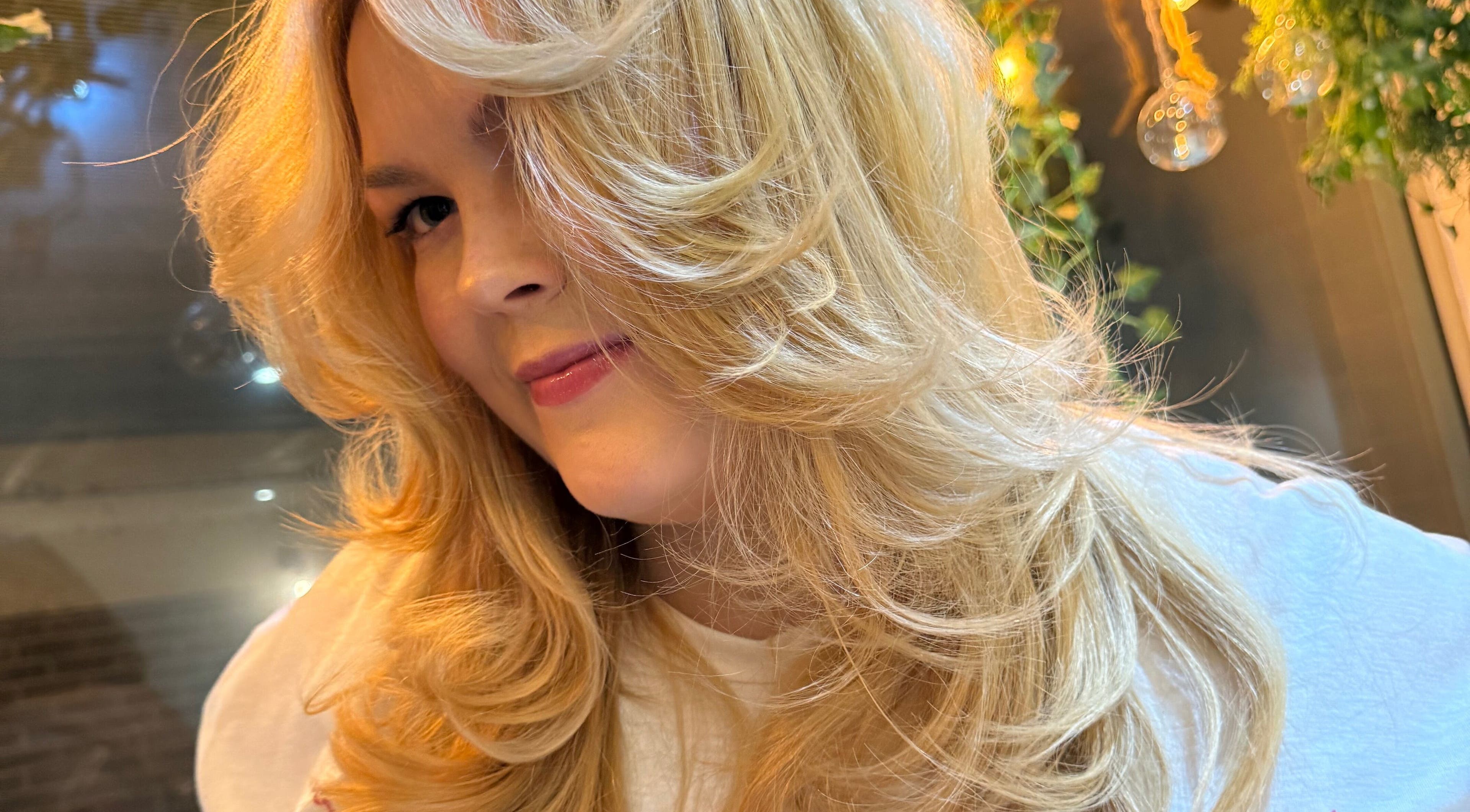 Blonde woman with styled curls at Hair By David, East Kilbride, Scotland, GB.
