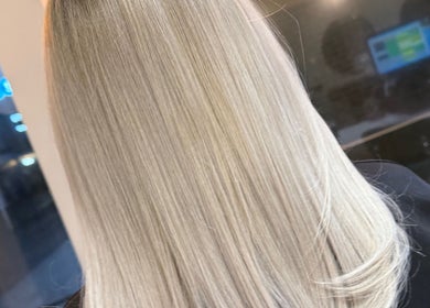 Beautifully styled blonde hair at Hair By David, East Kilbride, Scotland, GB. Shiny and sleek salon finish.