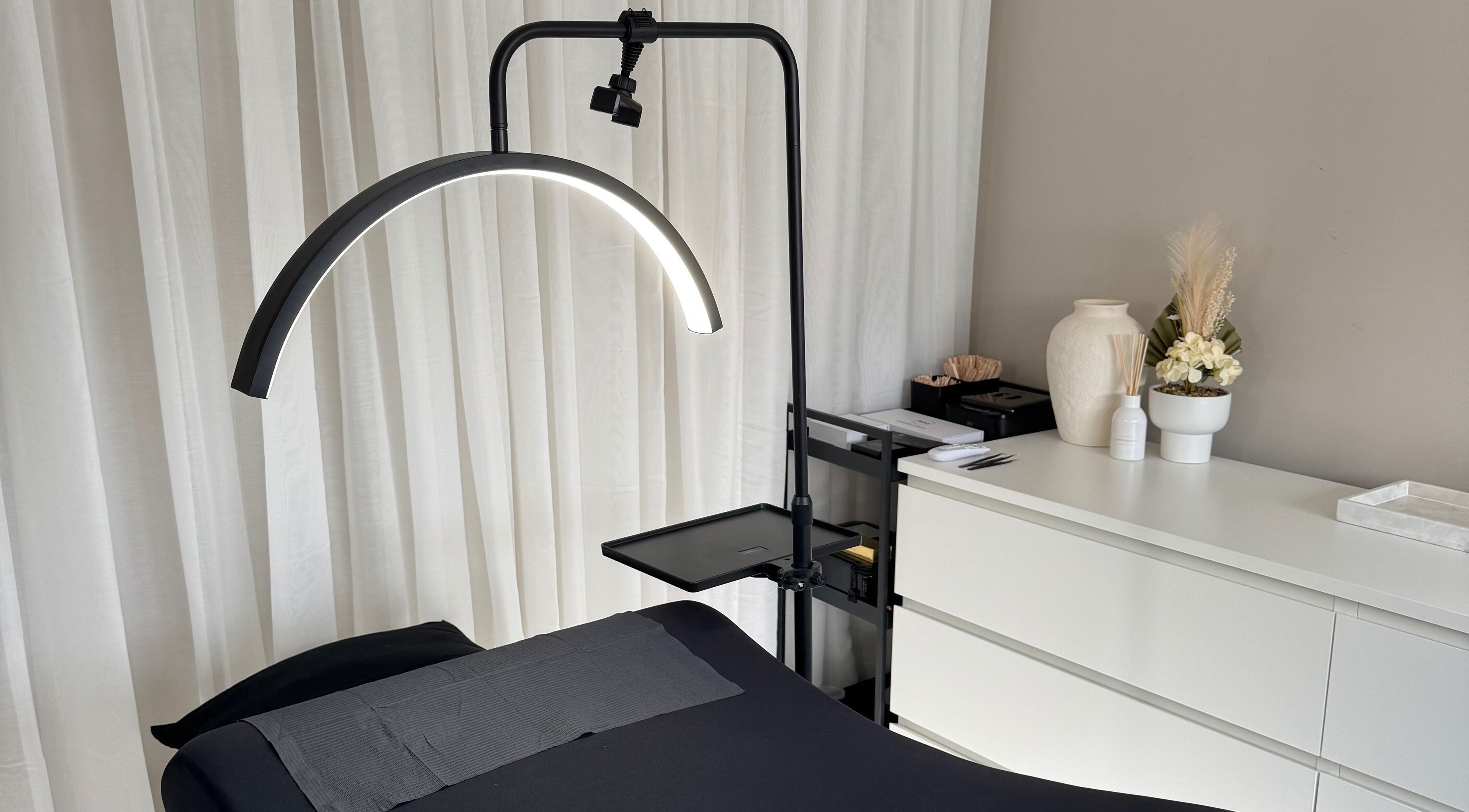Well-lit treatment room at Calista Bell Beauty, Melbourne, Victoria, AU, featuring a comfortable massage bed.
