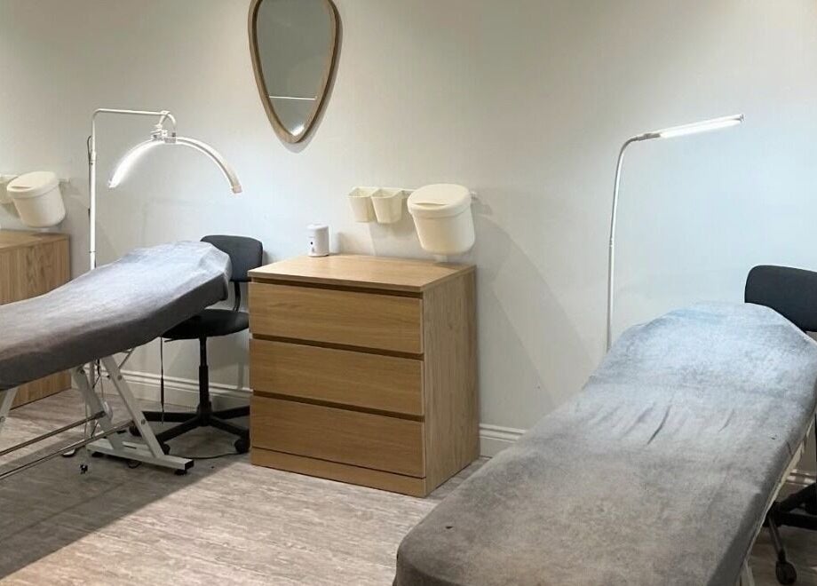 Calming treatment room at Feathers and Co, Padiham, England, GB, featuring soft beds and soothing lighting.