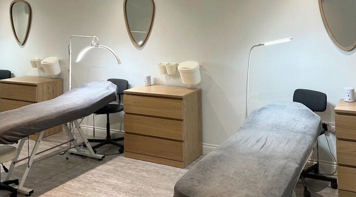 Calming treatment room at Feathers and Co, Padiham, England, GB, featuring soft beds and soothing lighting.
