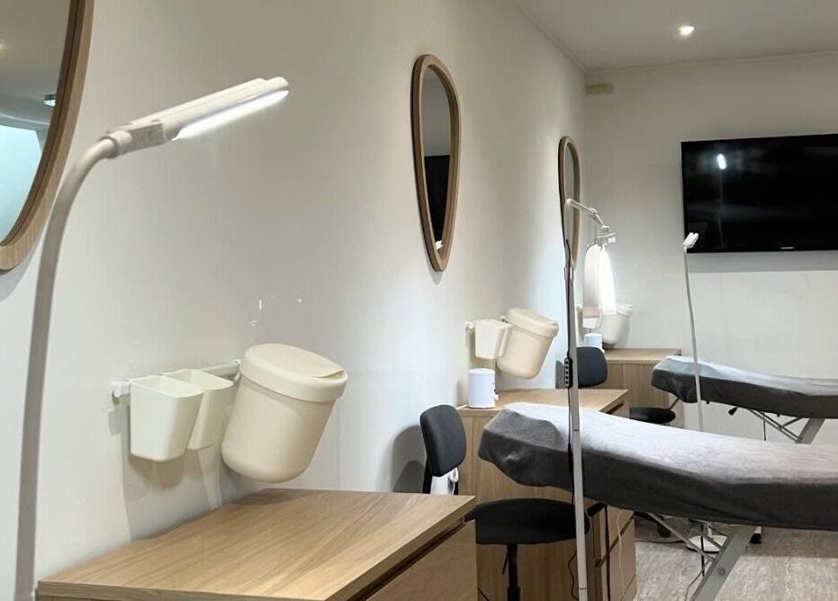 Elegant treatment room at Feathers and Co, Padiham, England, GB. Features modern decor and comfortable treatment beds.
