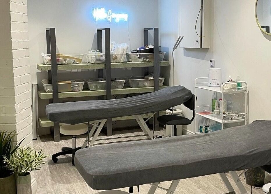 Relaxing spa room at Feathers and Co, Padiham, England, GB, featuring treatment tables and tranquil decor.