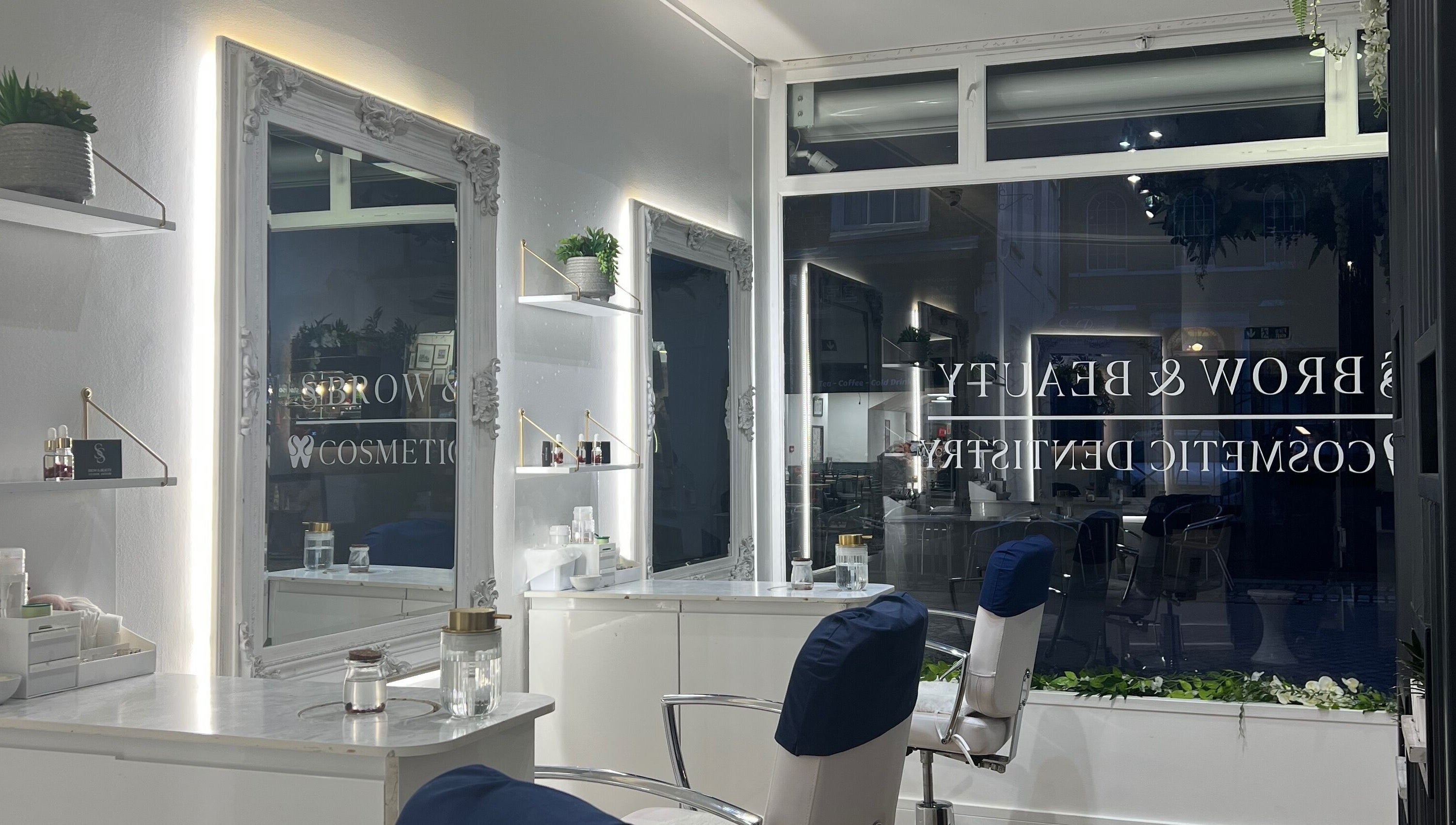 Modern salon interior at SS Brow & Beauty, Canterbury, England, GB, showcasing elegant styling stations.