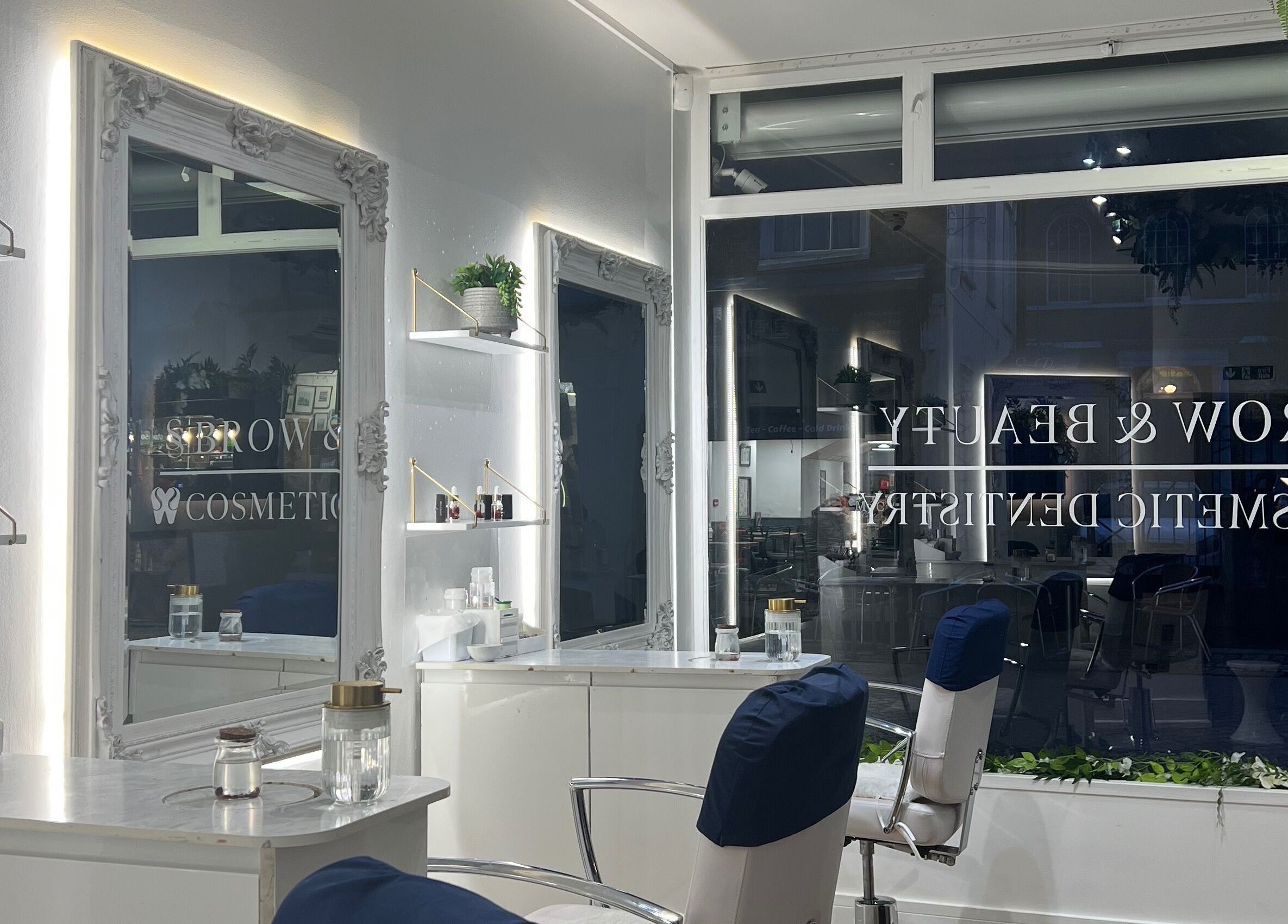 Modern salon interior at SS Brow & Beauty, Canterbury, England, GB, showcasing elegant styling stations.