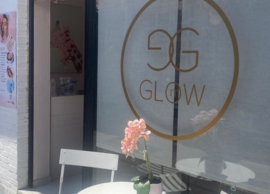 Glow it salon entrance with elegant decor in Limenas Chersonisou, GR, featuring a welcoming sign.